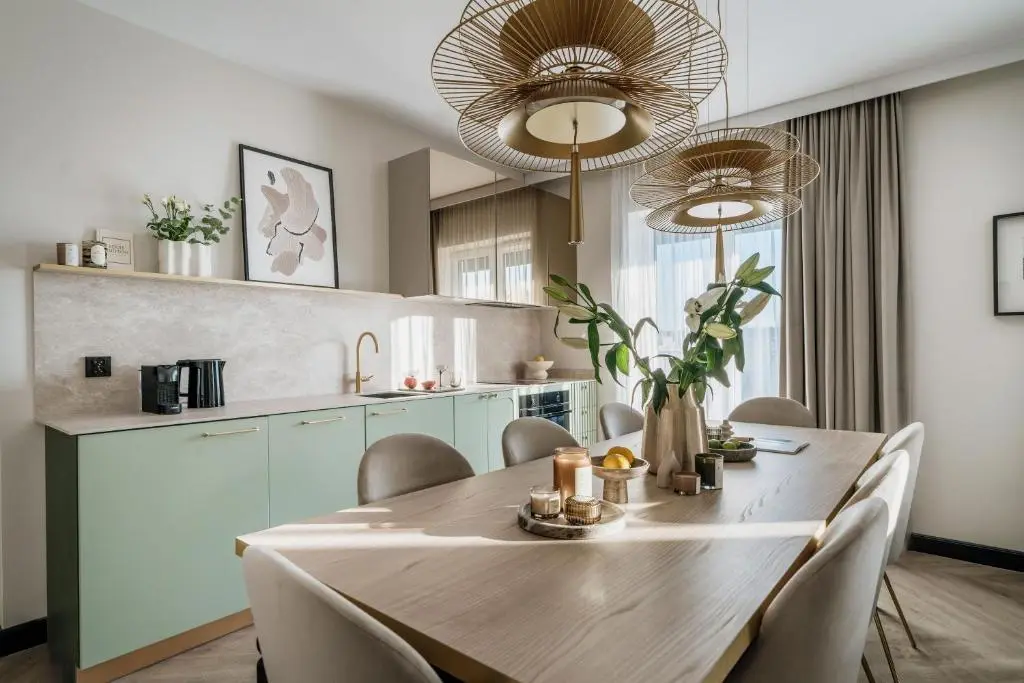 Dining area with a kitchenette in a Millou apartment